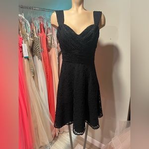 Mori Lee Size 12. Black dress with Black Lace and Button detail up the back.